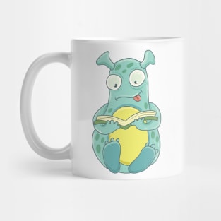 Monster reading a book Mug